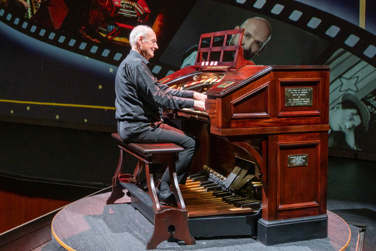 Person playing the mighty wurlitzer